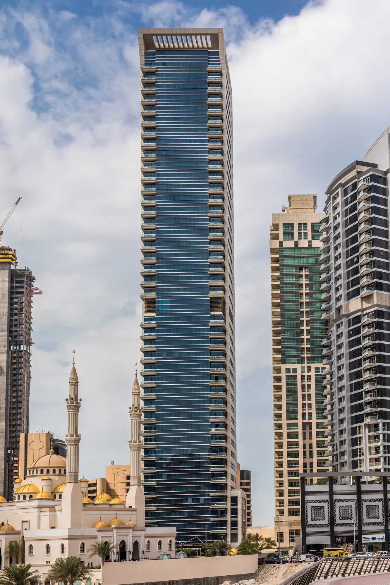 Waterfront promenade lined with residential towers